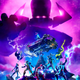 A loading screen for Fortnite’s latest Marvel crossover season, showing Marvel characters surrounding the game’s battle bus.